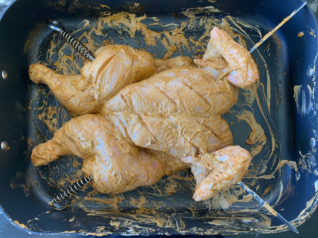 Spatchcock tandoori chicken with skewers - example.